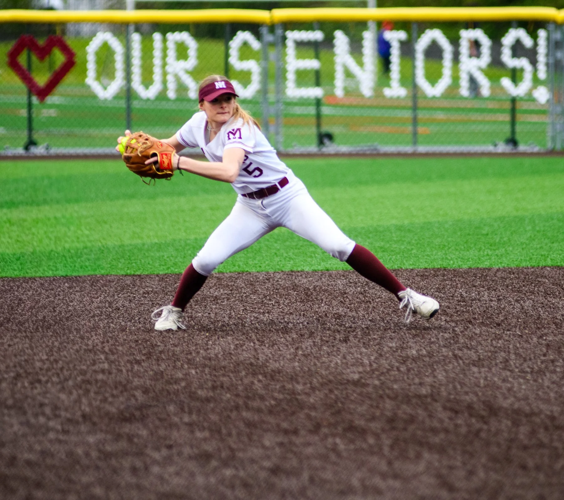 Mercer Island softball pitcher delivers a pitch.