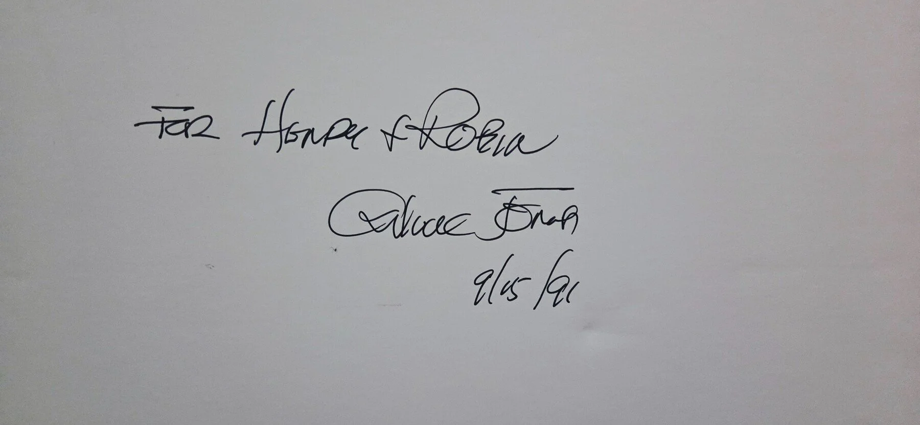 Handwritten dedication photographed with Dances with Wabbits artwork
