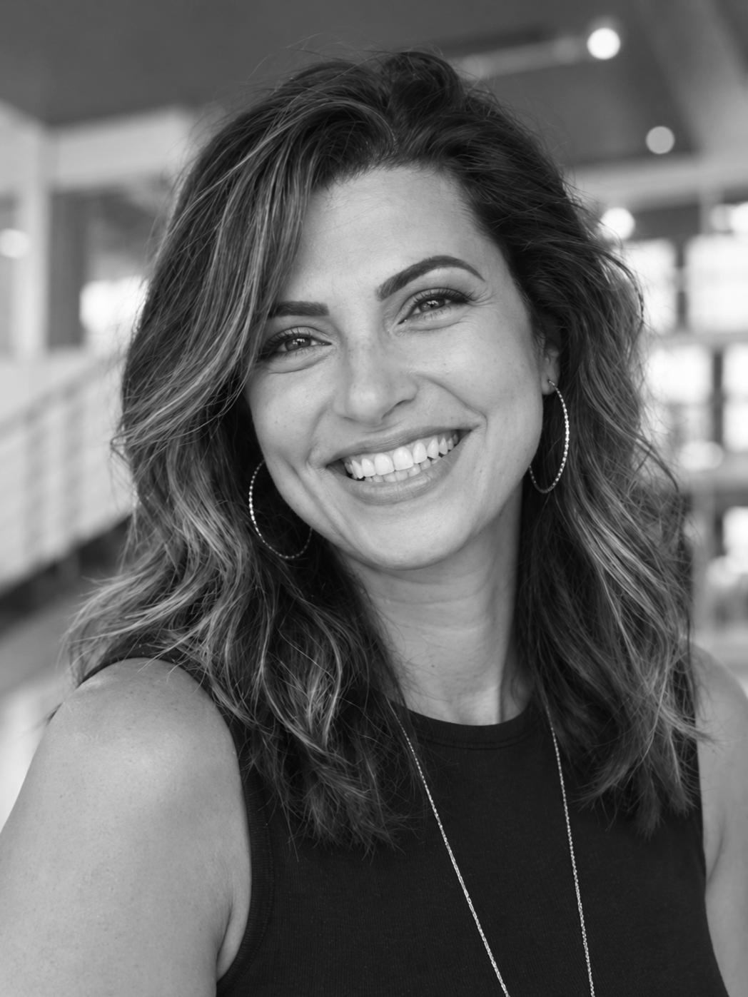 Black-and-white portrait of Lydia Alfred, architect, interior designer, and founder of IDEA Archteriors.
