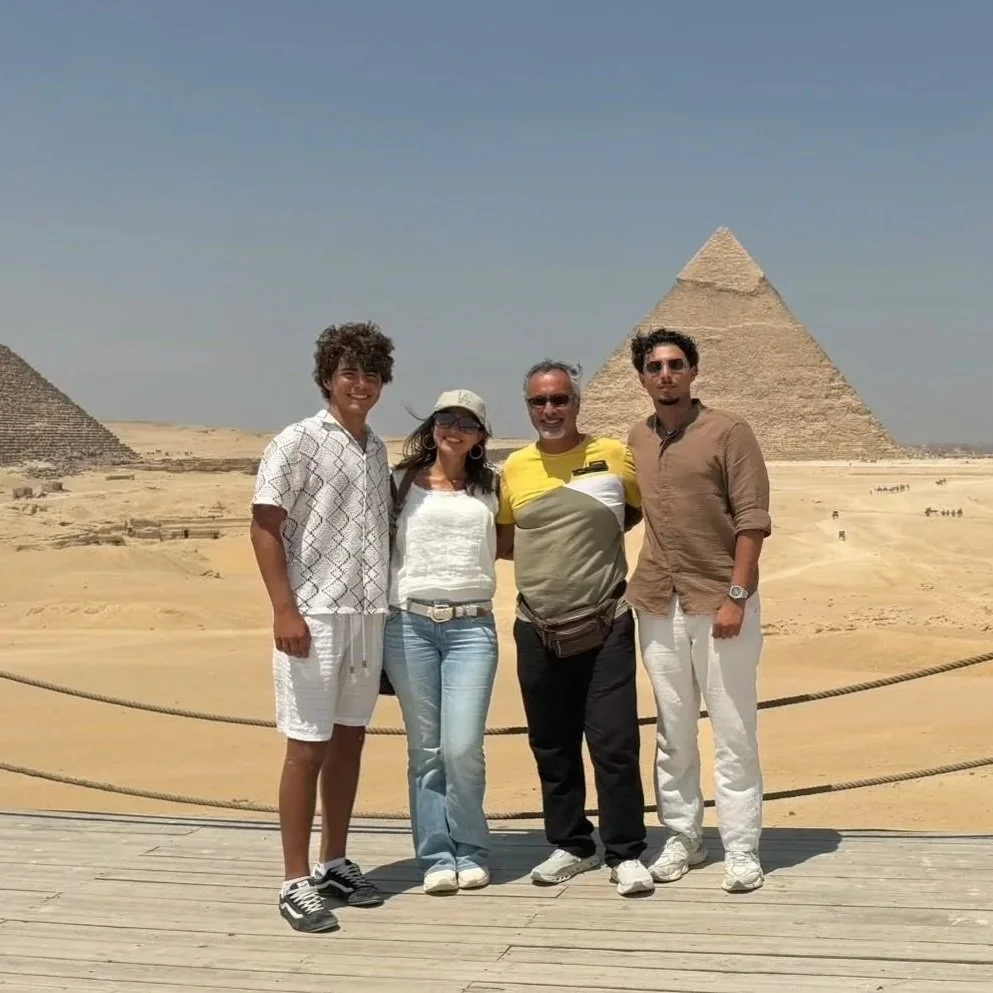 Lydia Alfred and her family visiting the Pyramids of Giza in Egypt.