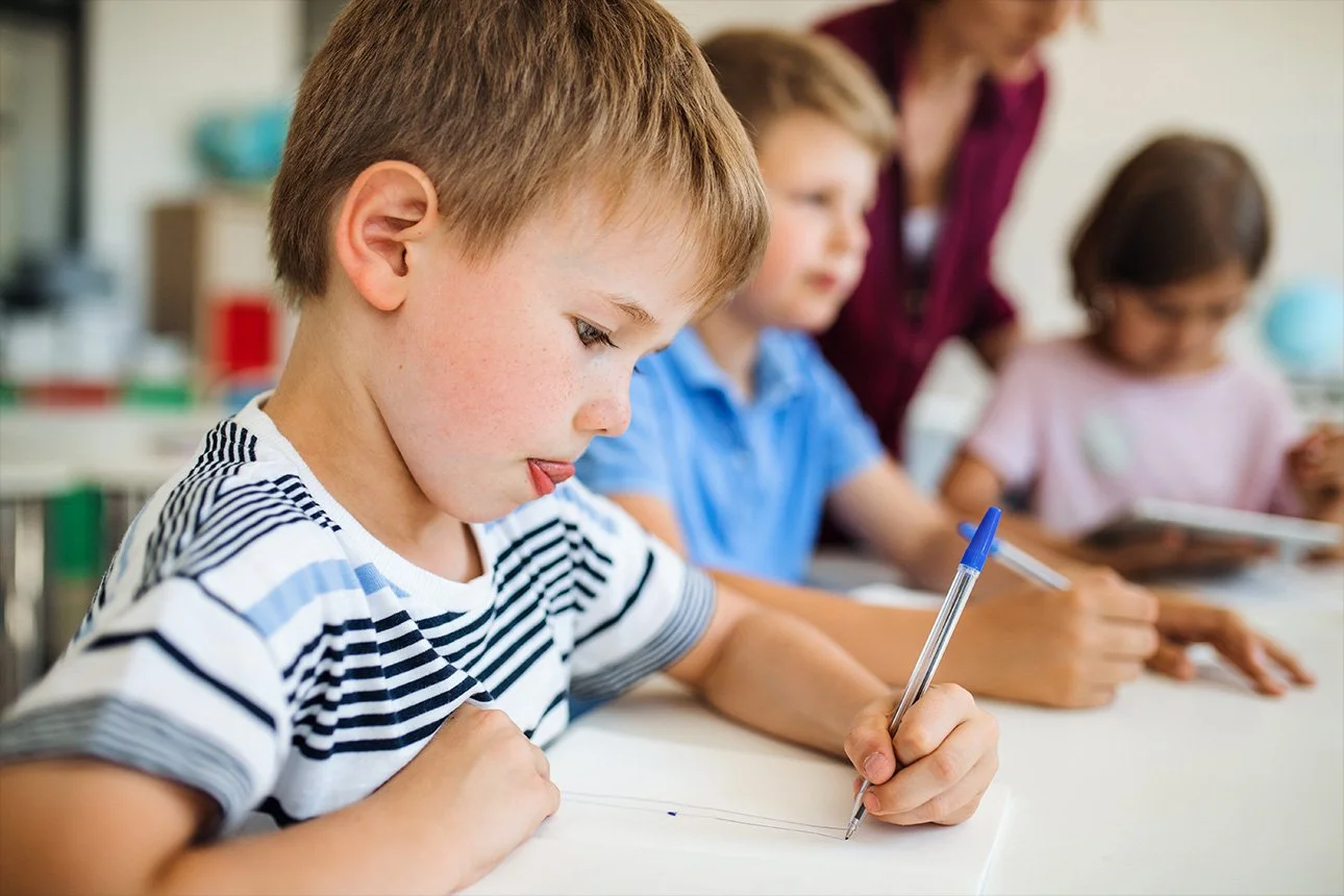 child practicing drawing
