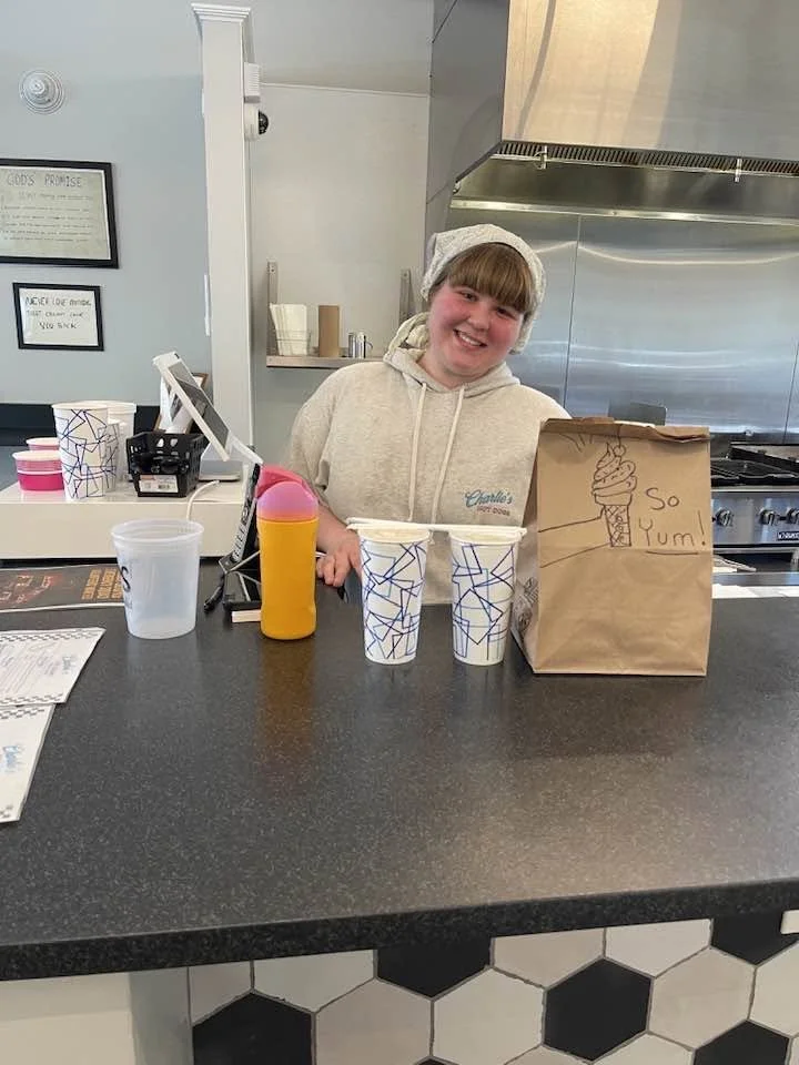 Sara B and her art work on the to go order