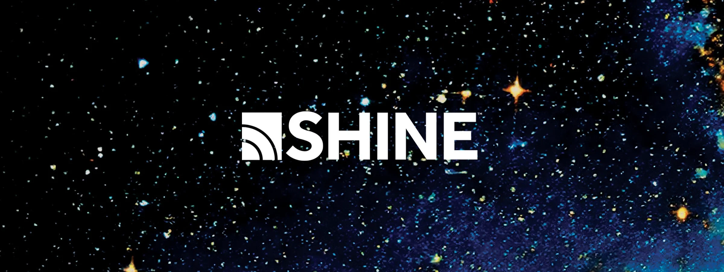 Cosmic background with stars and the word "SHINE" in white capital letters, partially overlaying the background.