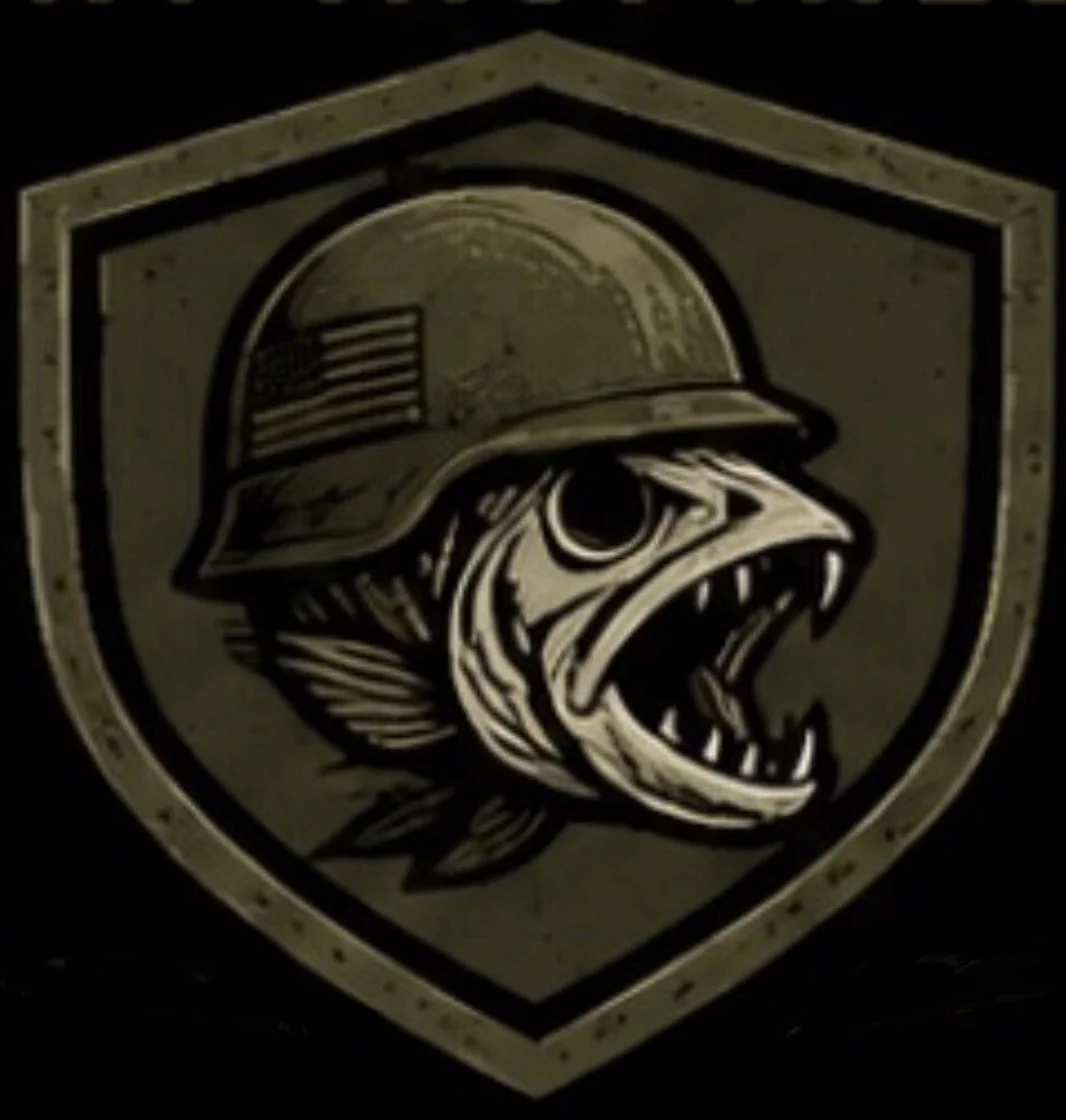 A logo featuring a fish wearing a military helmet with an American flag patch, inside a shield outline.
