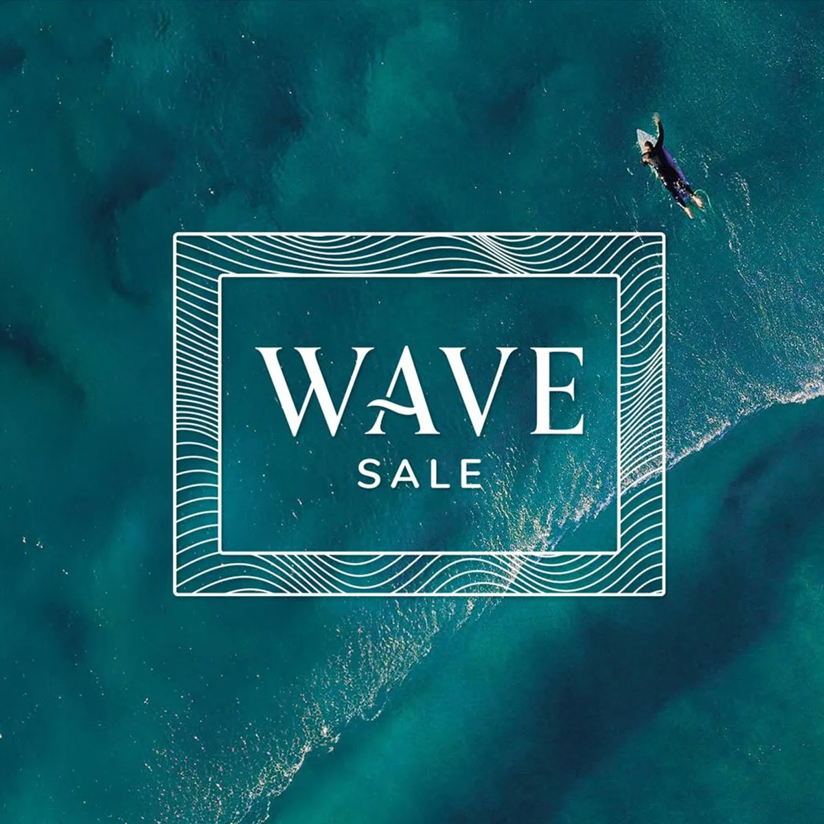 An aerial view of a person surfing on a wave with a promotional overlay for a 'Wave Sale' in white text within a rectangular frame.