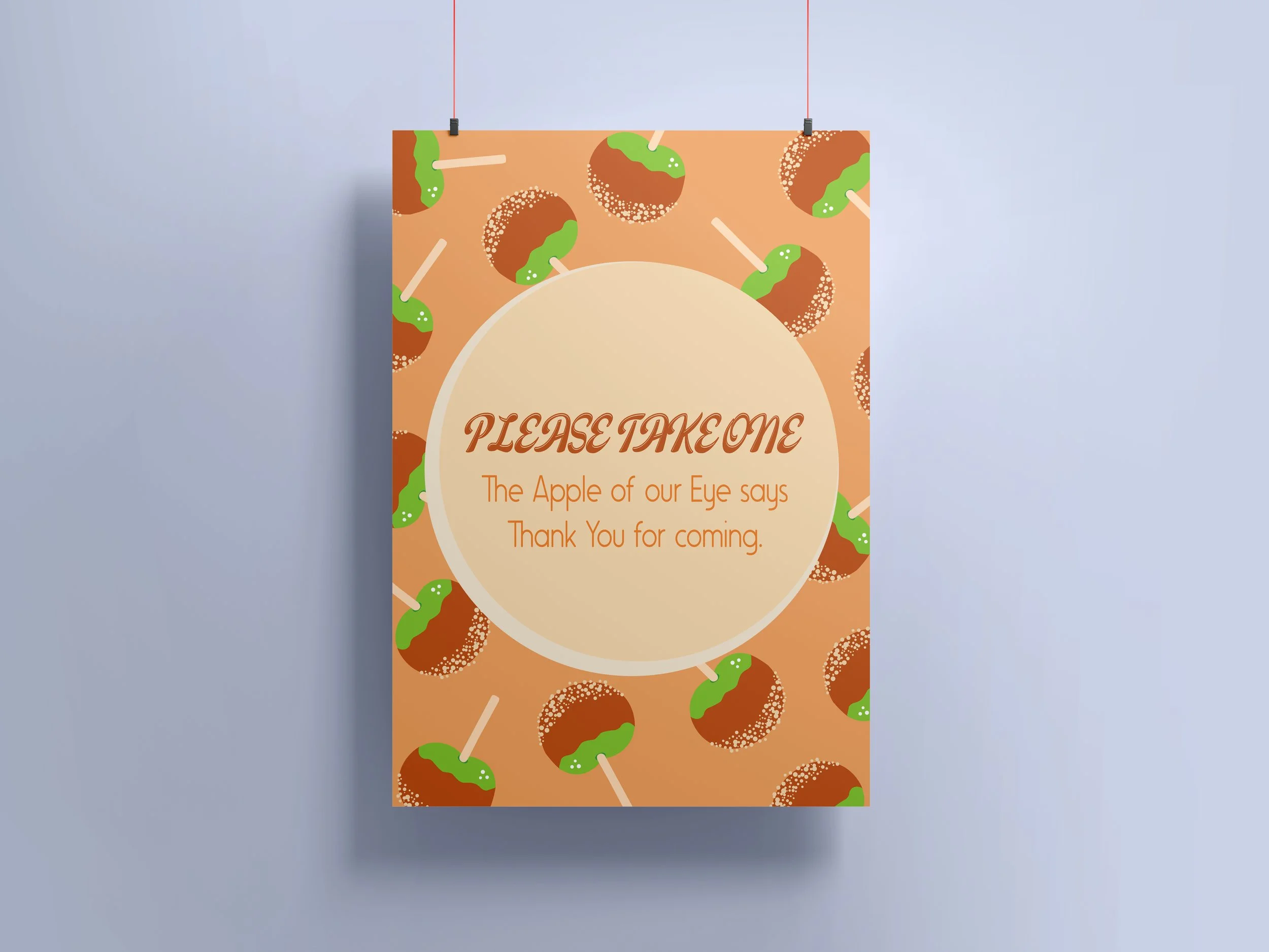 A decorative sign with a repeated pattern of caramel apples with green caramel and white sticks. The sign has a beige circle in the center with the words 'Please Take One' in a brown script, and a message thanking visitors for coming.
