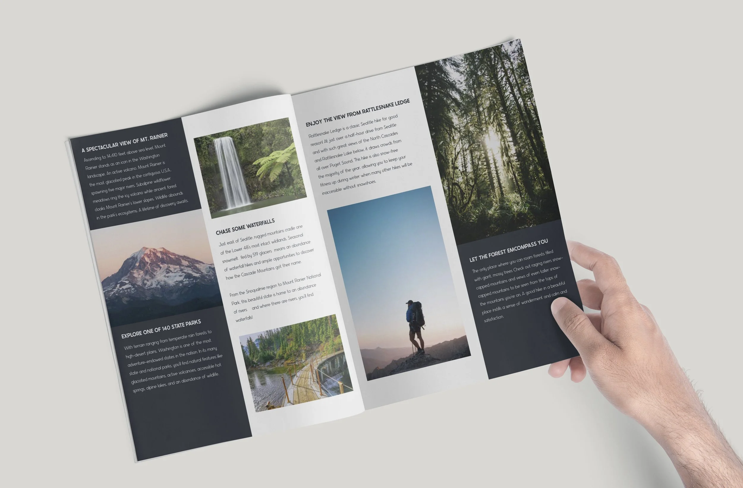 A person holding a brochure featuring images of waterfalls, forests, and mountains with text about exploring national parks.