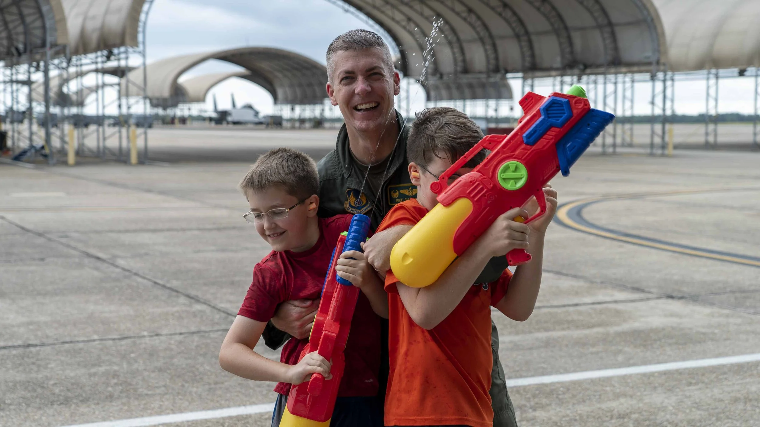 Mike “Hondo” Fiandt and his boys after Hondo’s last flight in the Air Force. Traditional “Fini Flight” spray down by family and friends at the end of an assignment or career. Hondo is a proud Air Force veteran, engineer, and wood worker.