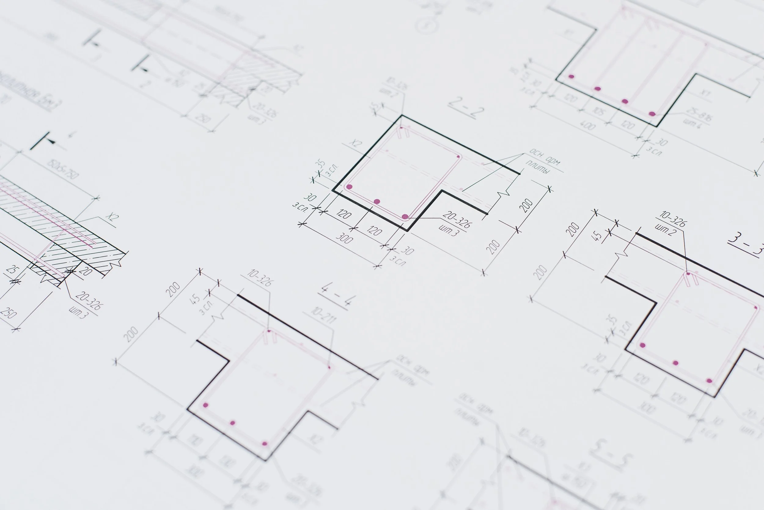 Architectural blueprint with detailed measurements and floor plan outlines.