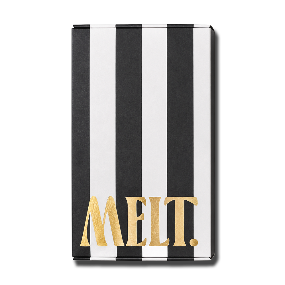 Black and white striped chocolate box with the word "MELT" written in large gold letters on the front. Available At Curated in Watertown, SD