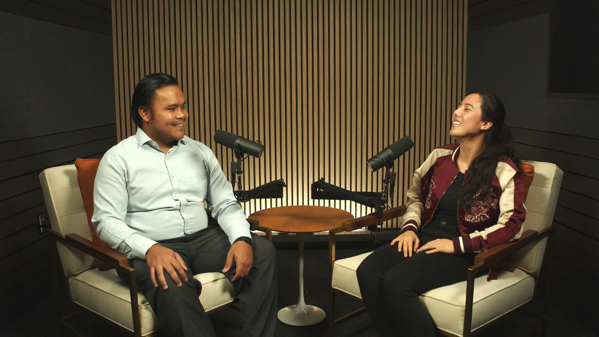 Two people recording a video podcast in lounge chairs on The Burnside set at Studio TwentyOneTwelve in Portland