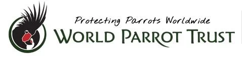 Logo of World Parrot Trust featuring a stylized black and white parrot head with a red beak, and text that reads 'Protecting Parrots Worldwide' and 'World Parrot Trust'.
