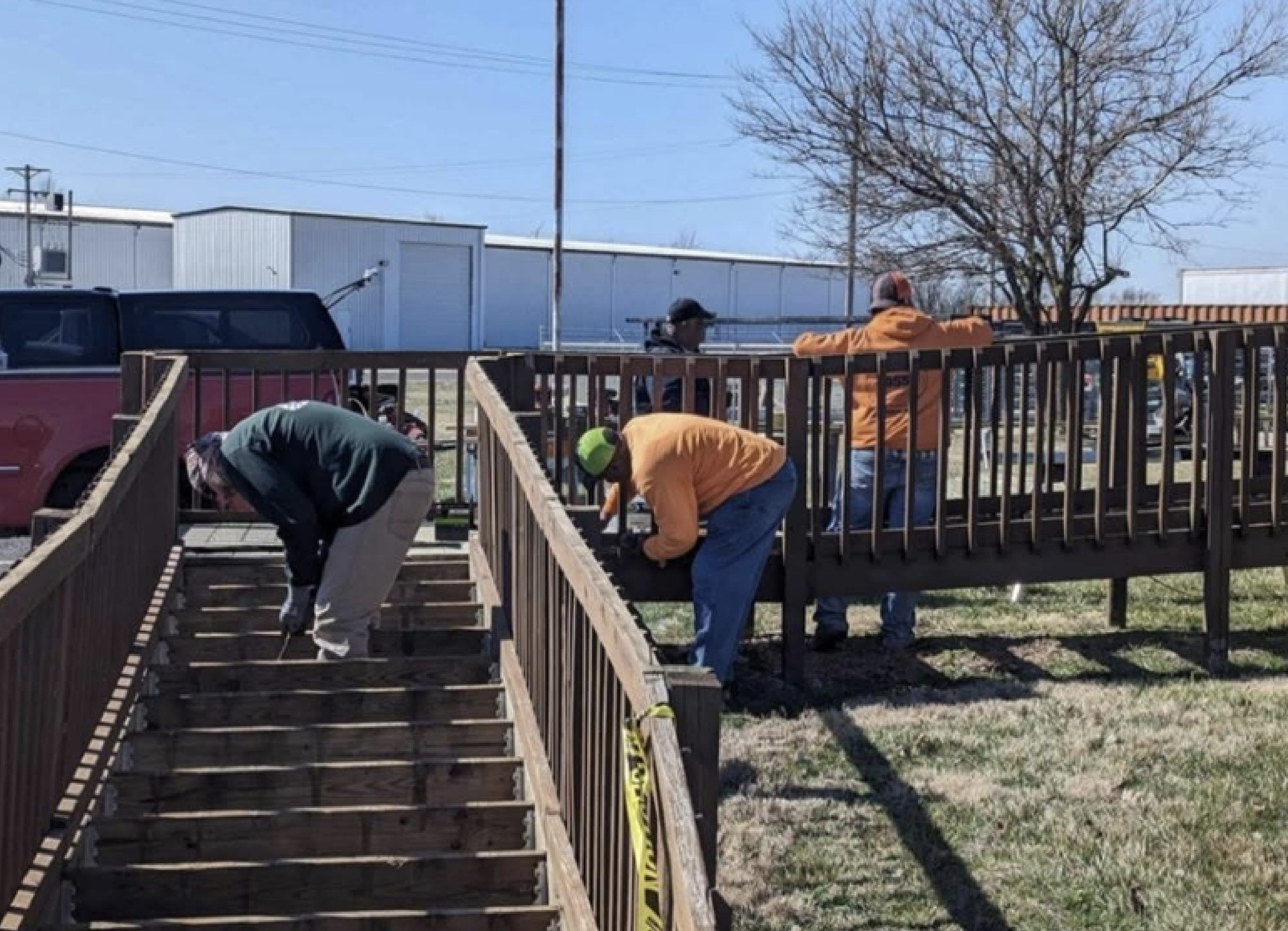 Image of three contractors working outside