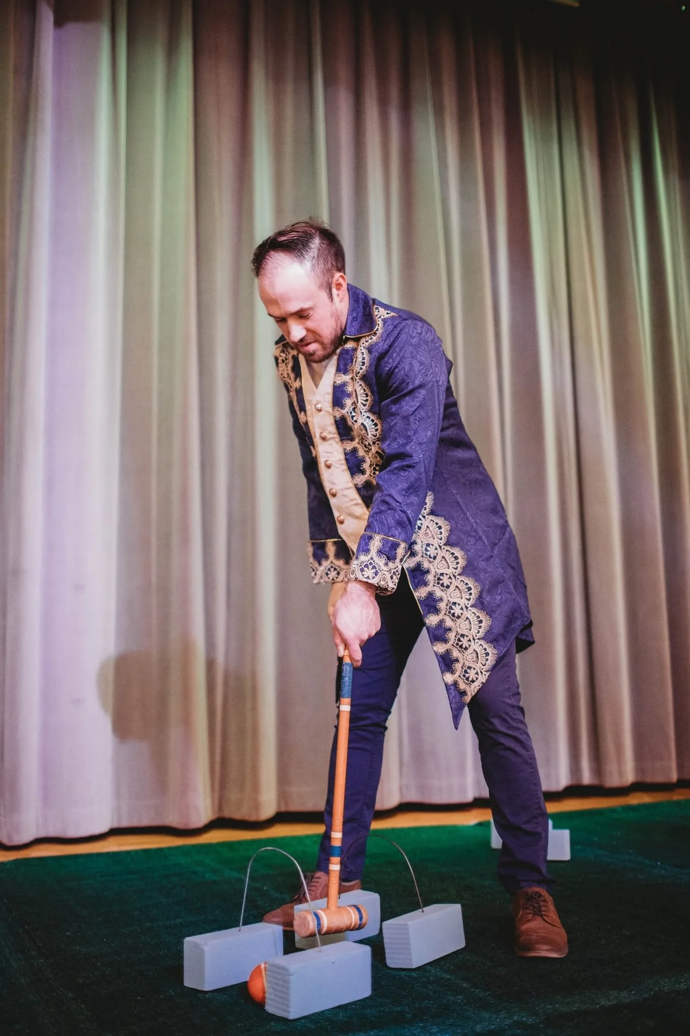 Image of a man playing croquet