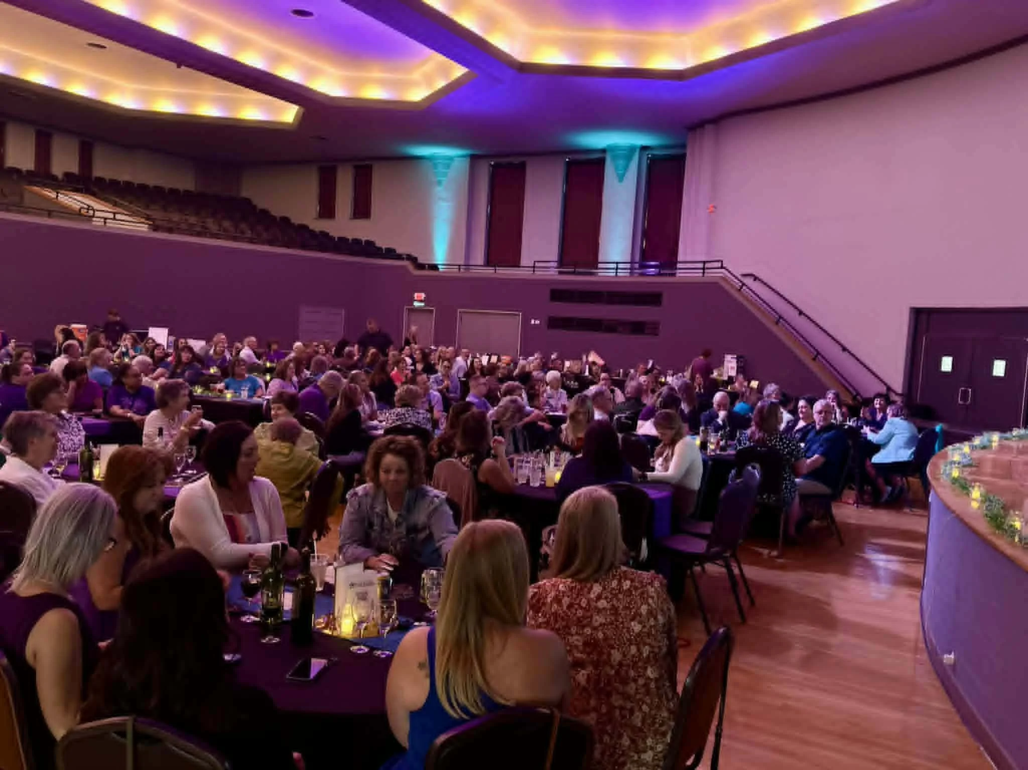 Image of a crowd sitting down at tables