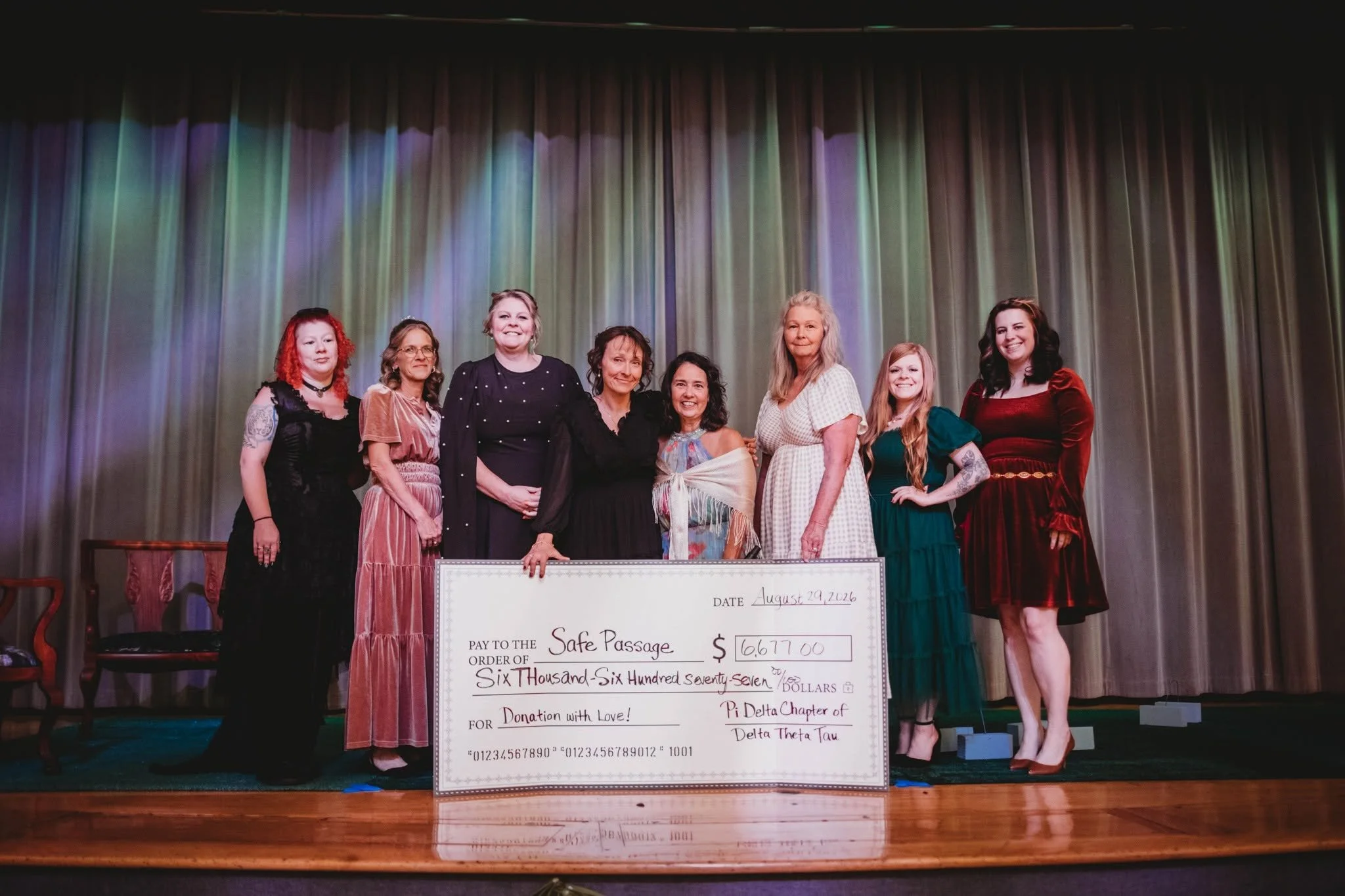 Image of a group of women accepting a large check