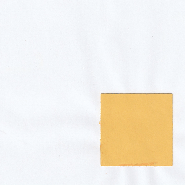 A yellow sticky note on a white surface