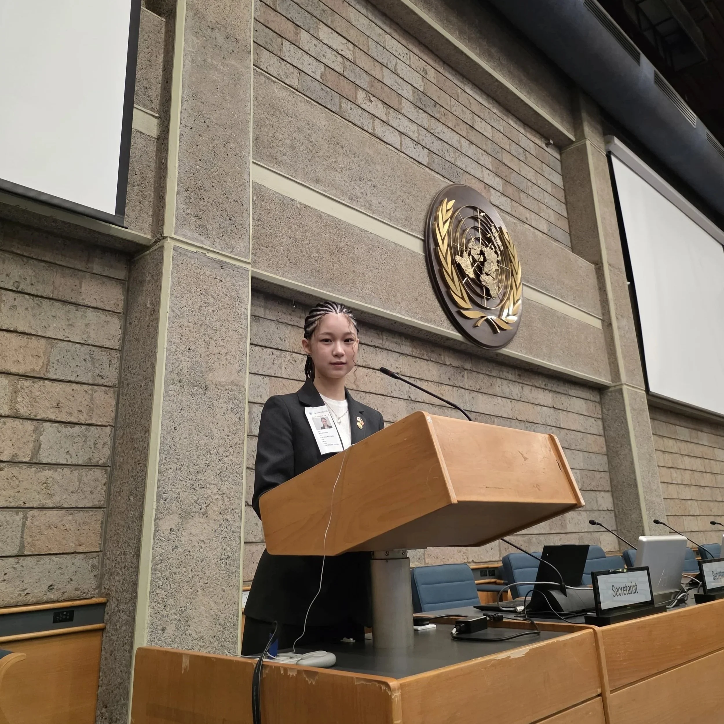 Seojin "Summer" Choi, South Korea Global Youth Leader Representative, standing in the stage at one of the conference rooms at United Nations office in Nairobi, Kenya