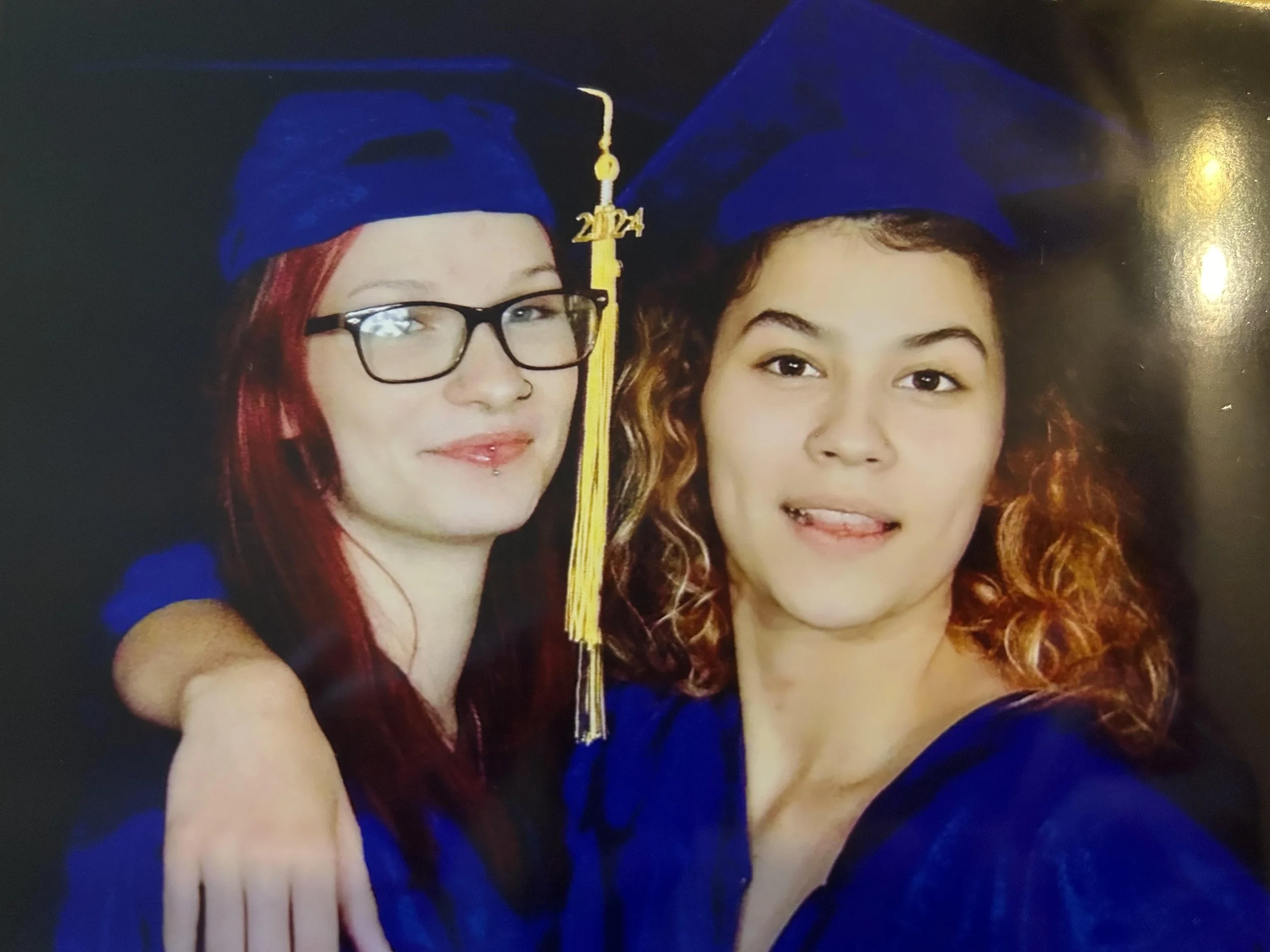 Makayla and her sister's graduation photo.