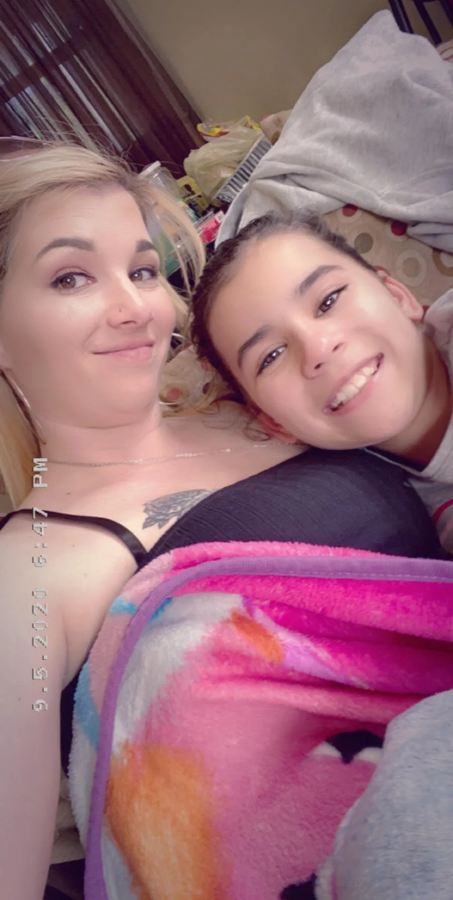 Makayla and her mommy sitting on the couch.