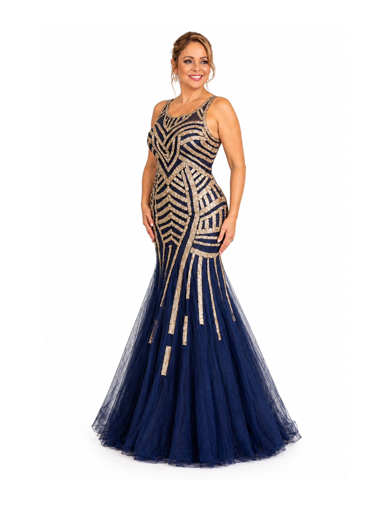 A woman in an elegant navy blue and gold sequined evening gown with a fitted bodice and a full tulle skirt, smiling and posing against a white background.