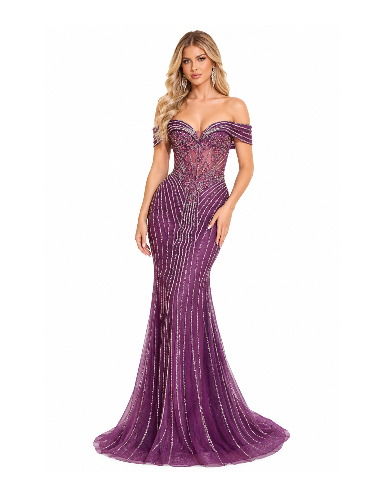 A woman in a fitted, off-the-shoulder purple evening gown with intricate silver embellishments, standing against a plain white background.