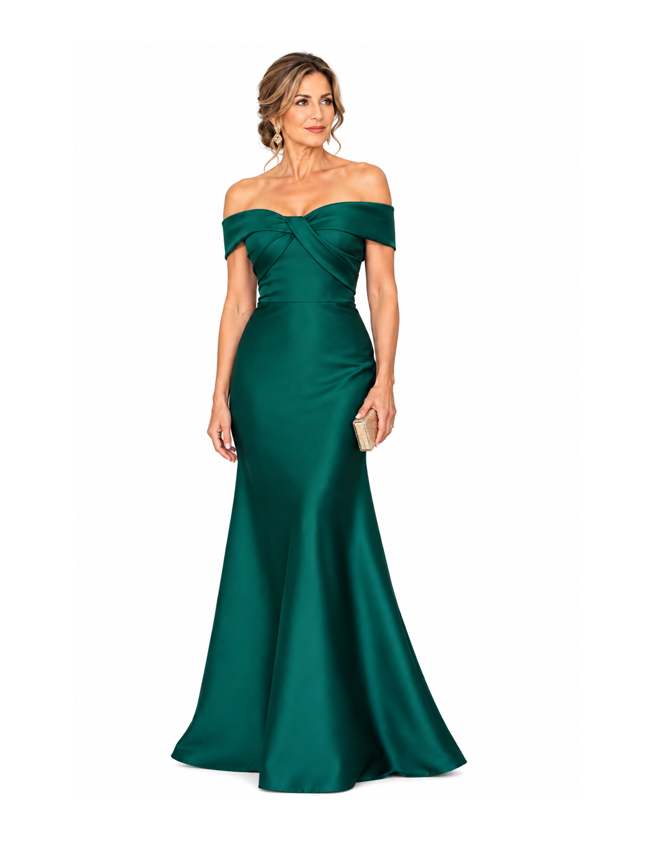 A woman wearing an elegant off-shoulder emerald green gown with a mermaid silhouette, accessorized with earrings and holding a small beige clutch, against a plain white background.