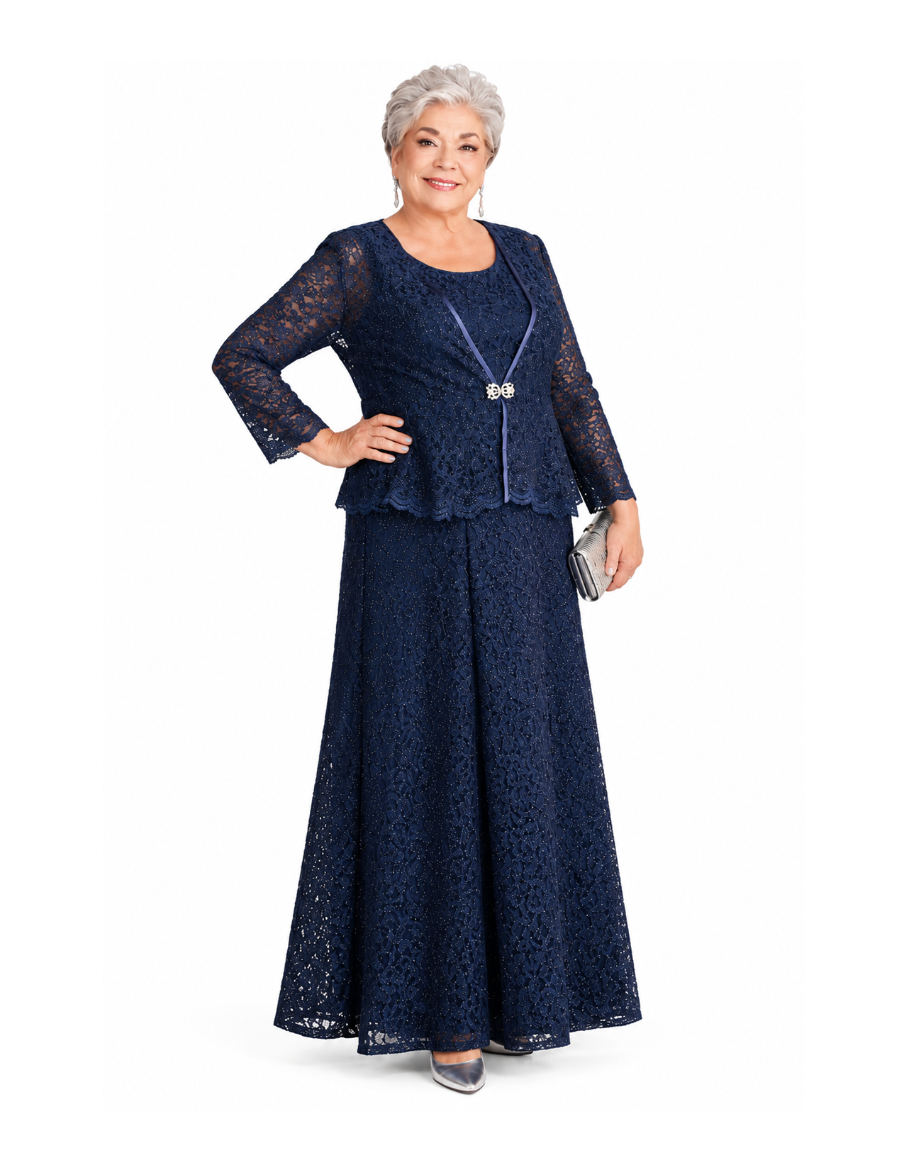 An elderly woman with white hair wearing a navy blue lace formal gown, holding a small silver clutch bag, standing against a white background.