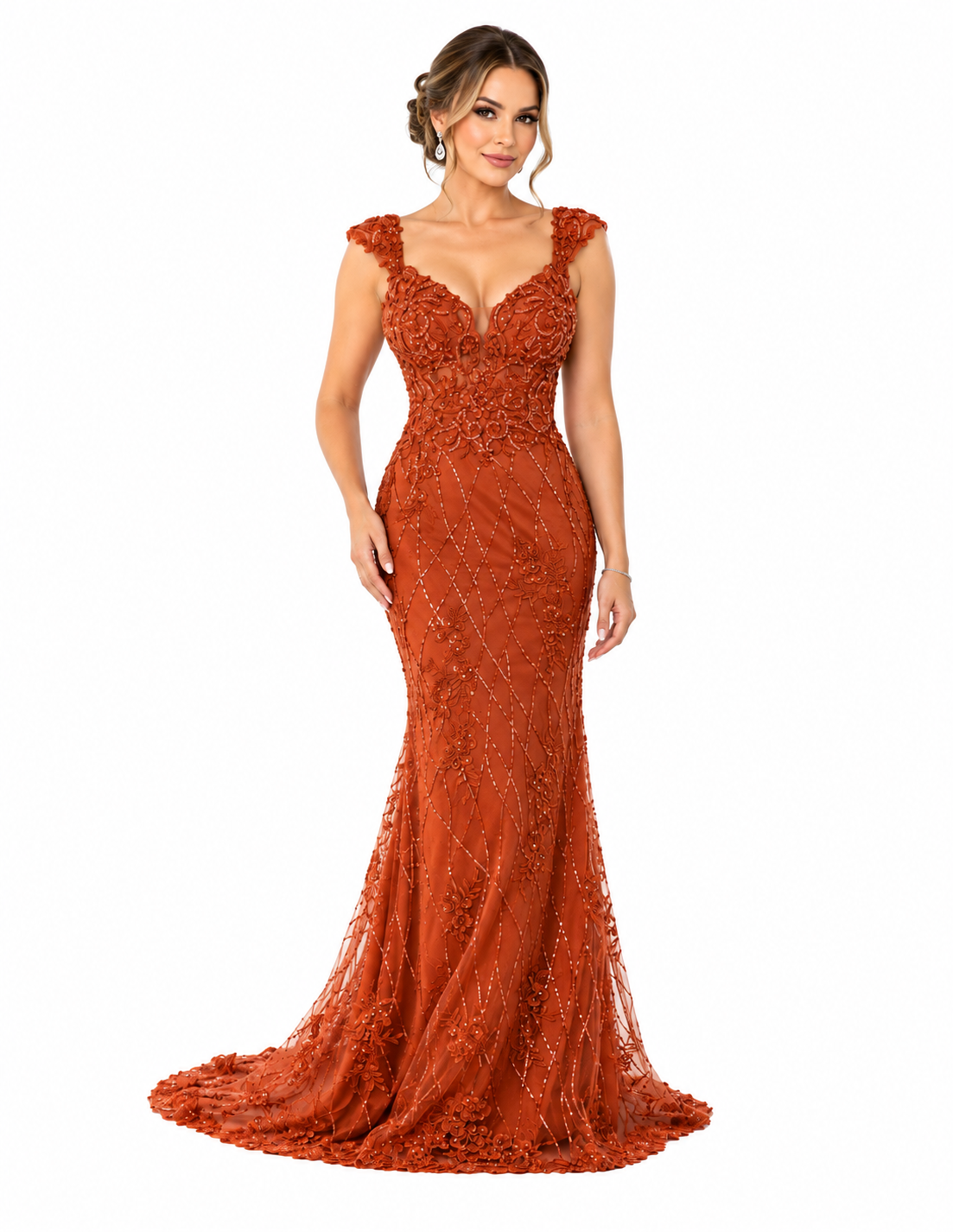 A woman wearing an elegant, fitted, orange gown with intricate embroidery and a slight train, posing against a white background.