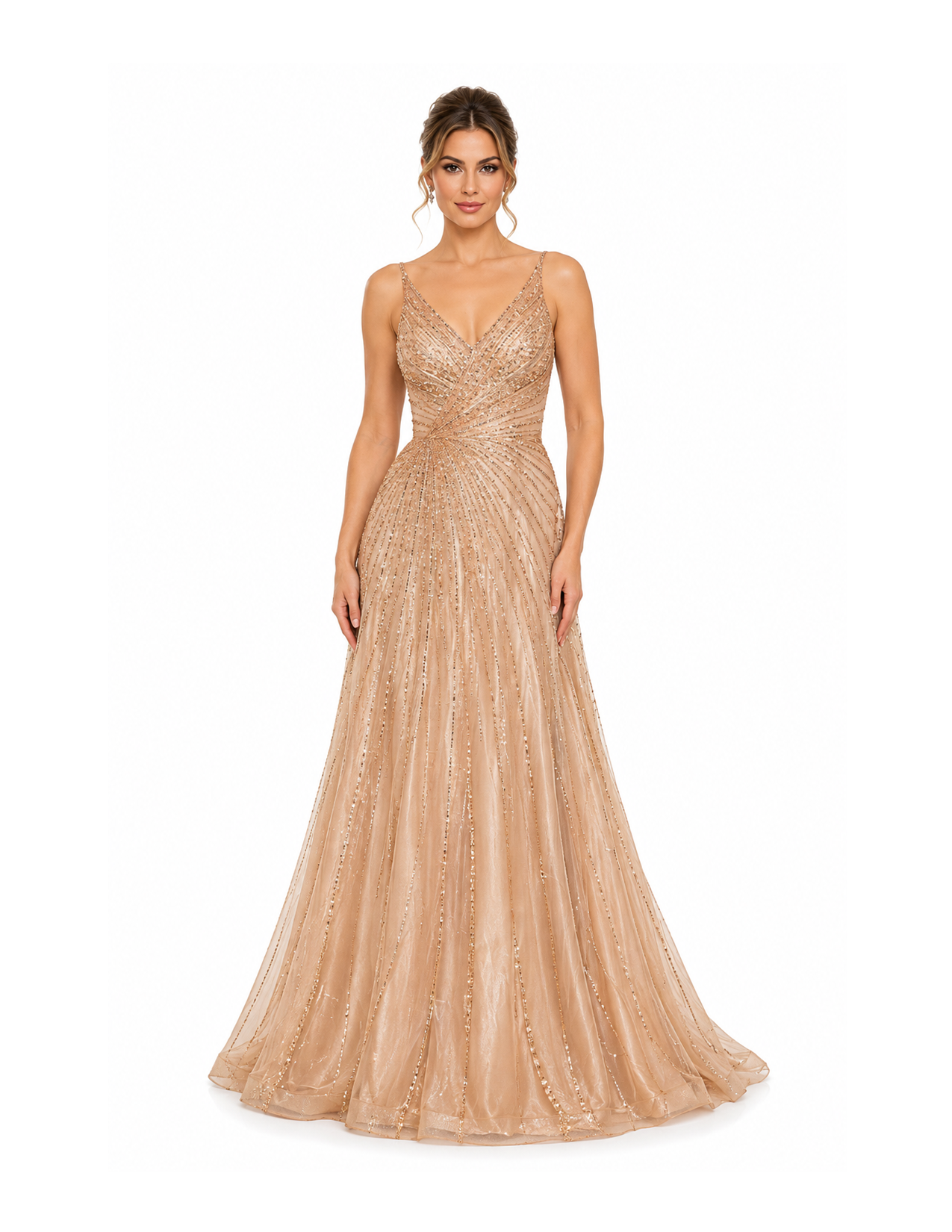 A woman modeling a floor-length, nude-colored, sequined evening gown with spaghetti straps and a V neckline, standing against a plain white background.