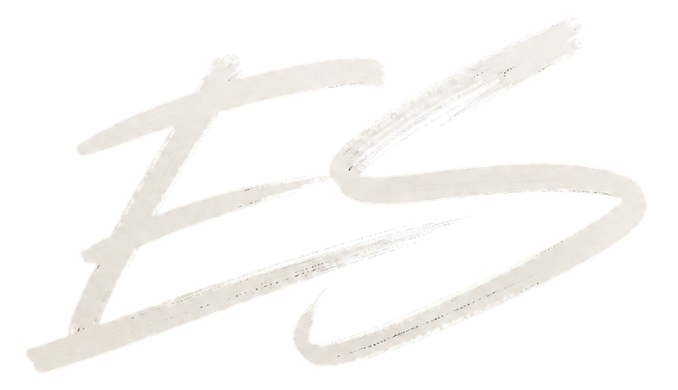 Close-up of a white scribble or signature on a black background.