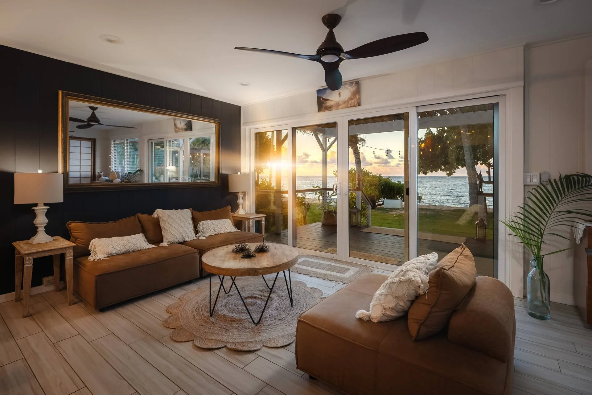 Vacation rental photography: living room with ocean sunset view through sliding doors