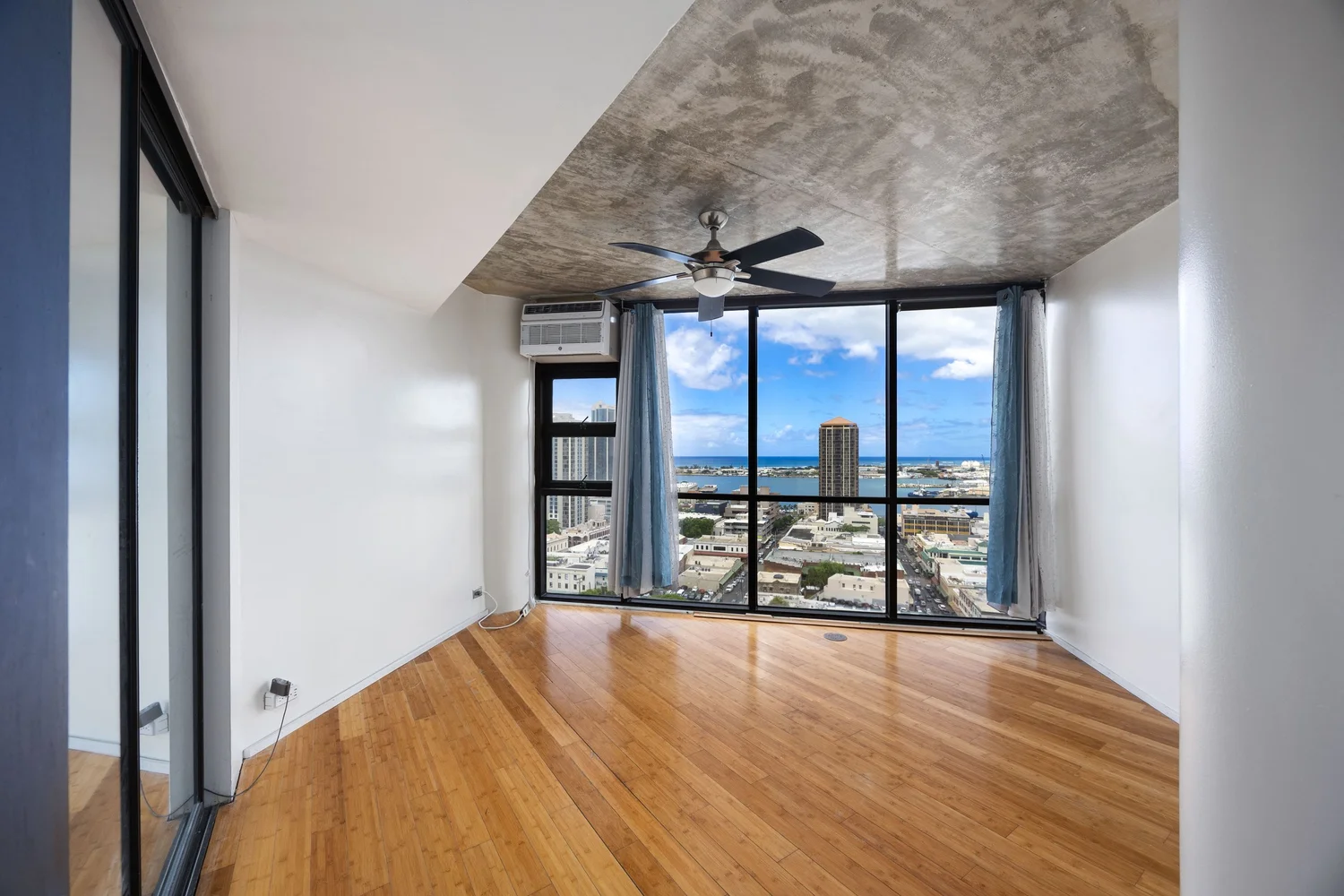 Empty bedroom before virtual staging in an Oahu property