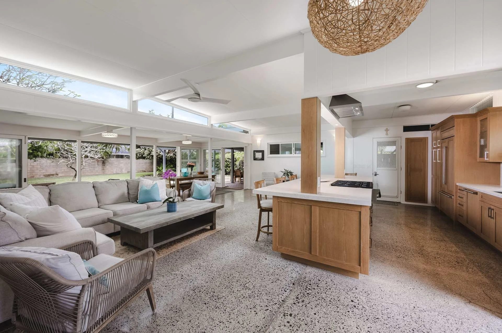 Residential real estate photography: bright open living room and kitchen in a Hawaii home