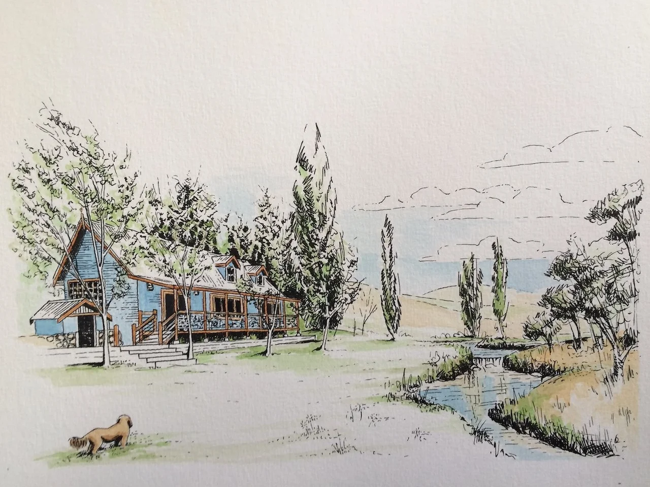 A watercolor illustration of a house with a deck next to a creek, surrounded by trees, with mountains in the background and a dog on the grass.