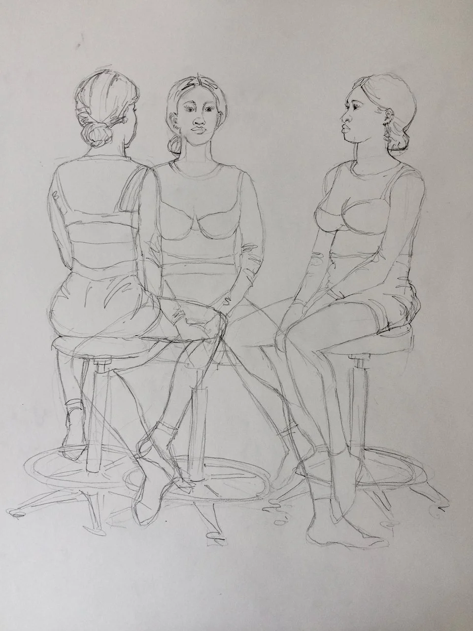 Sketch of three women sitting on stools, viewed from different angles, wearing casual clothing and shoes.