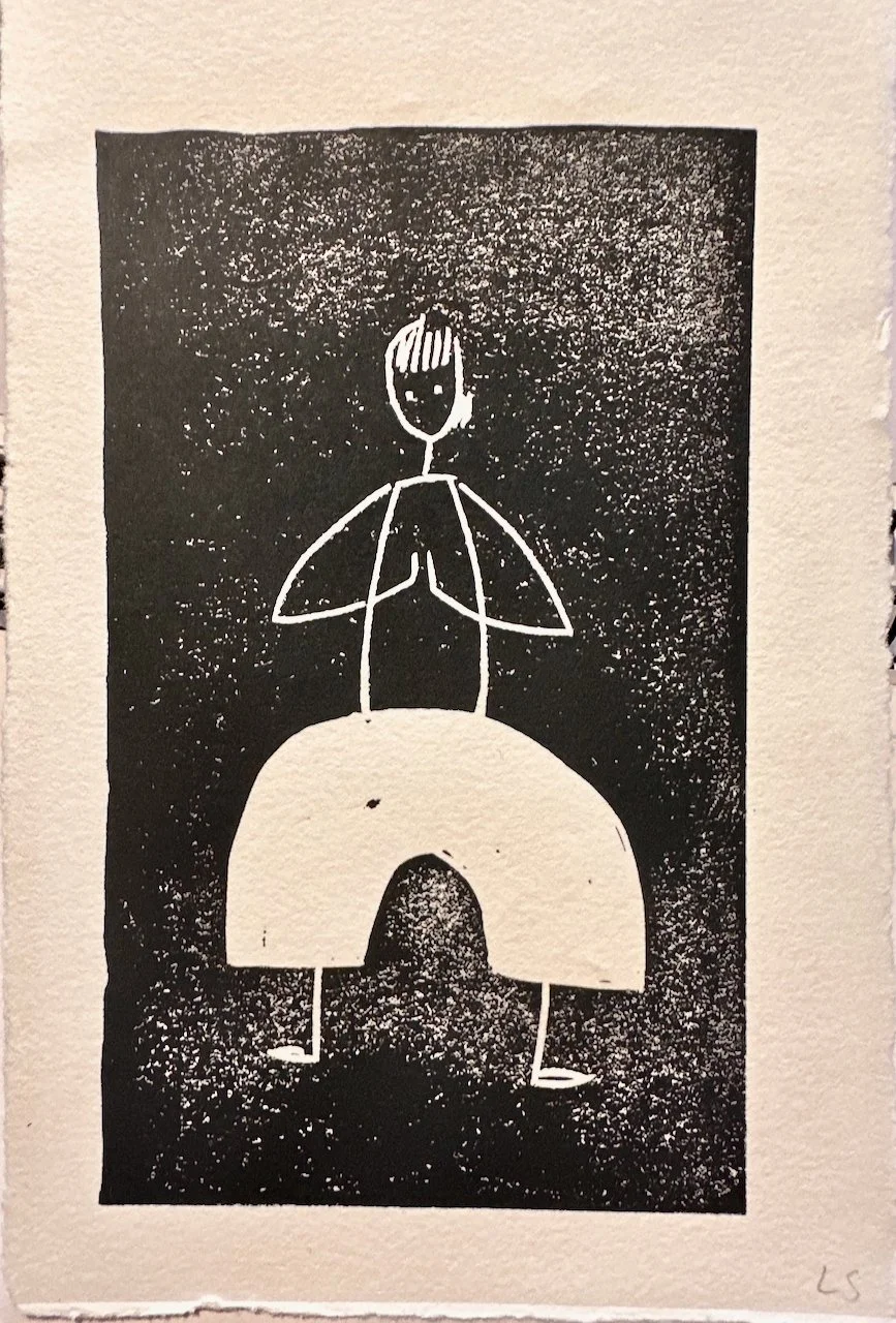Black and white abstract drawing of a figure with a small head, abstract facial features, large wide legs, and simple arms, standing against a textured dark background.