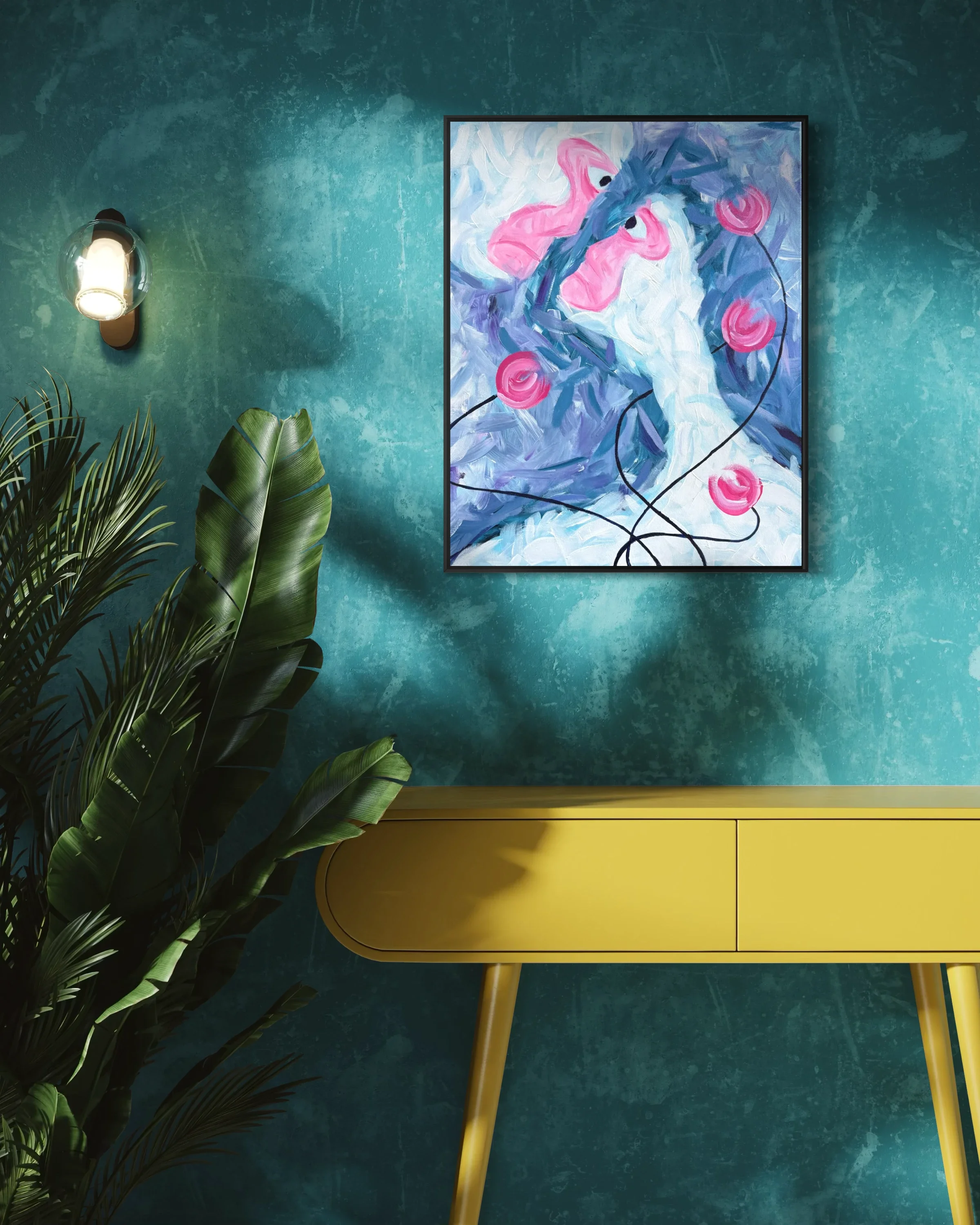 A yellow modern cabinet with rounded edges and three drawers, standing on four angled legs, placed against a textured turquoise wall. To the left, there are green tropical plants, and on the wall, a framed painting of pink flamingos and purple foliag