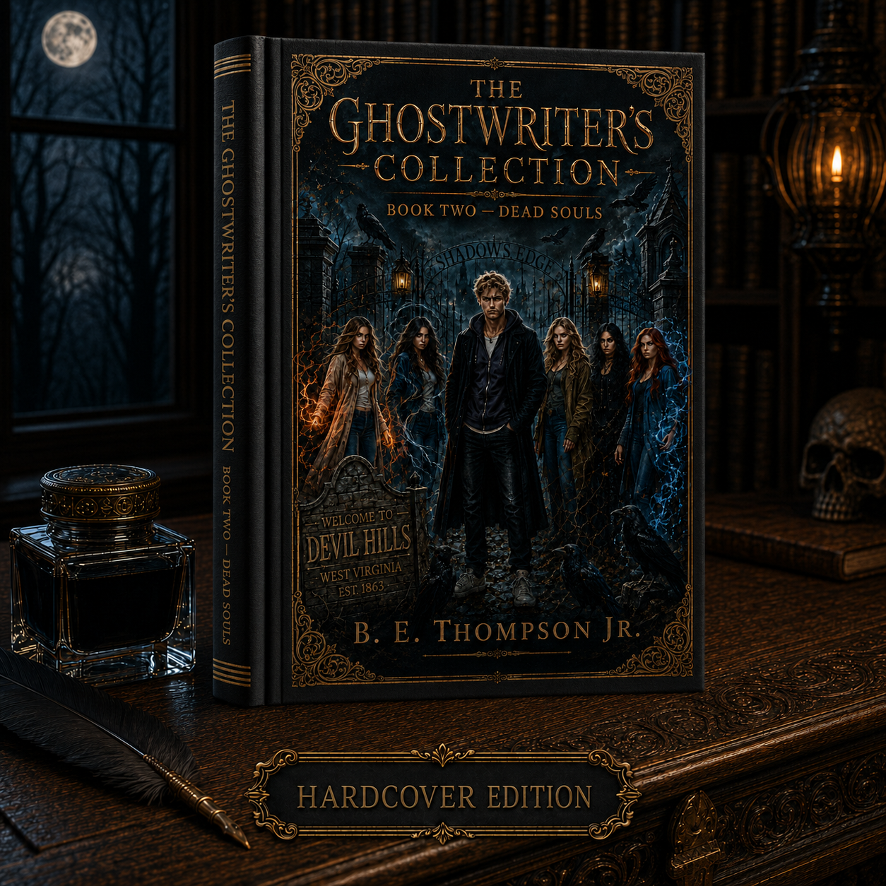 Book titled 'The Ghostwriter's Collection, Book Two - Dead Souls' by B. E. Thompson Jr. The cover features a dark, eerie scene with five young adults standing in front of a wrought-iron gate with the words 'Shadows Edge' above it, surrounded by crows, lightning, and leafless trees. The setting appears to be a haunted location in Devil Hills, West Virginia, established 1863. The book is a hardcover edition displayed on a wooden desk with a quill, inkwell, a lamp, and a skull in the background.