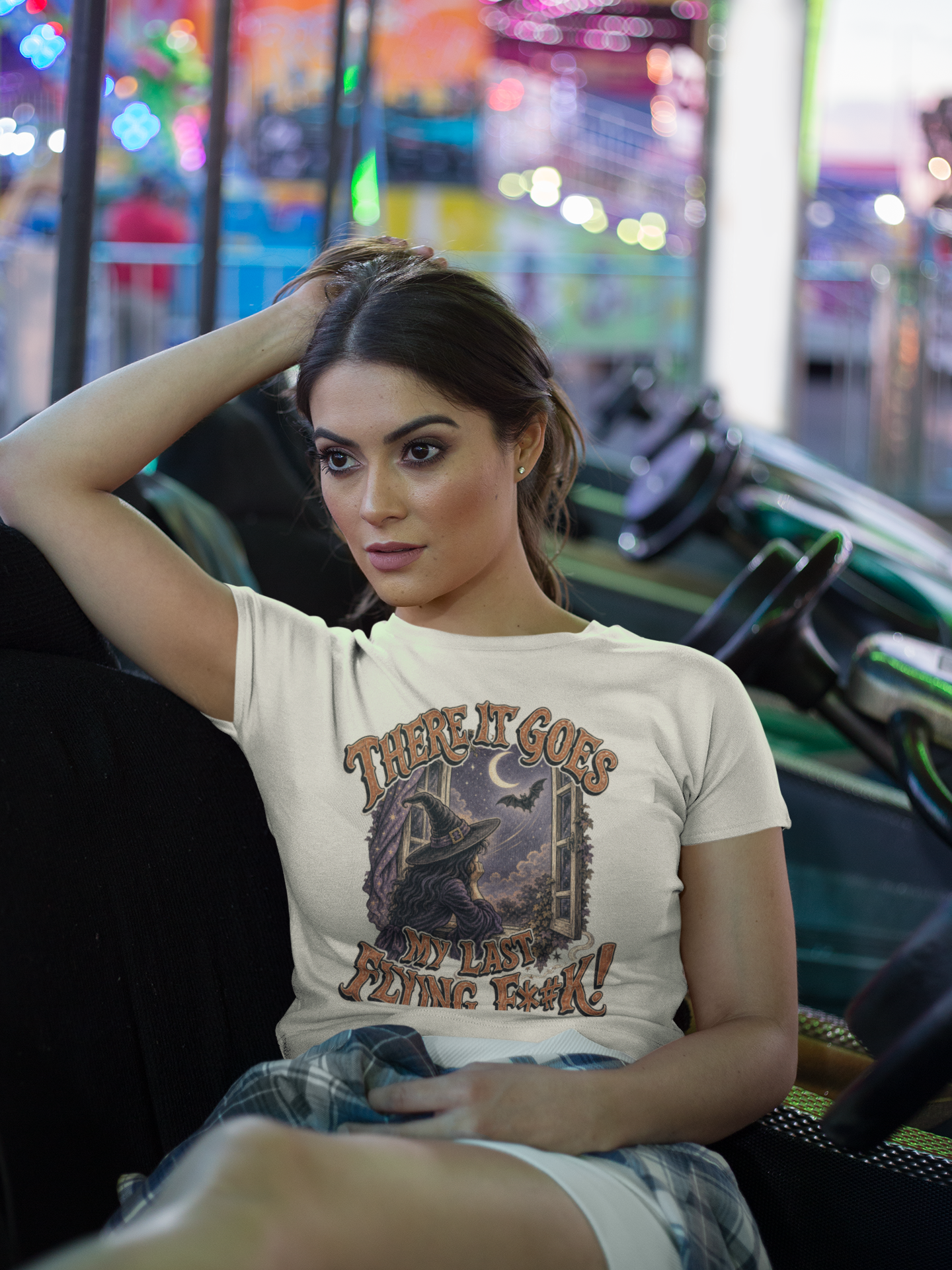 crop-top-tee-mockup-being-worn-by-a-girl-lying-on-the-arcade-car-games-a19440.png