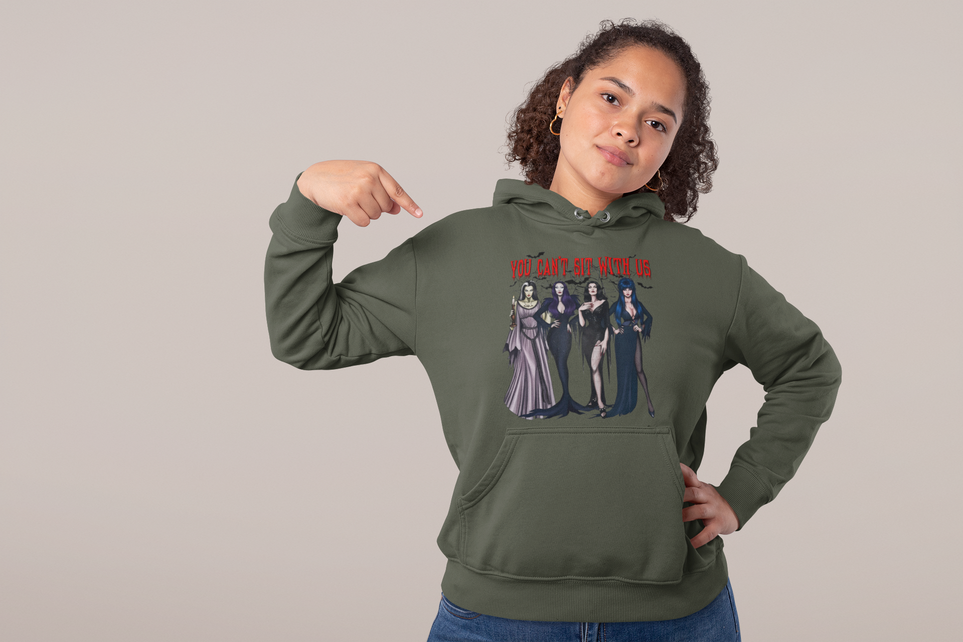 studio-mockup-of-a-confident-woman-pointing-at-her-hoodie-32002.png