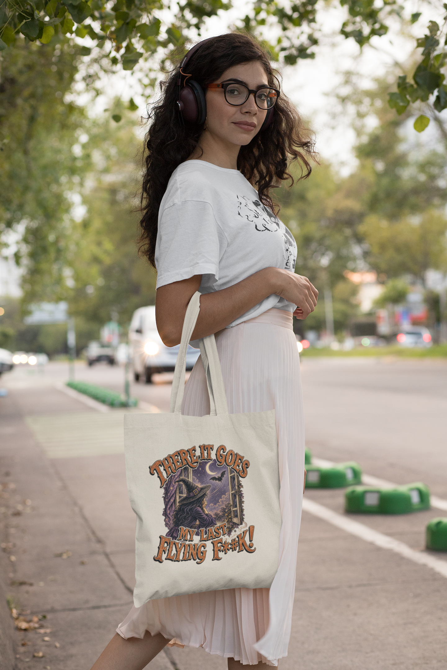 tote-bag-mockup-of-a-woman-with-headphones-on-the-street-29452.png