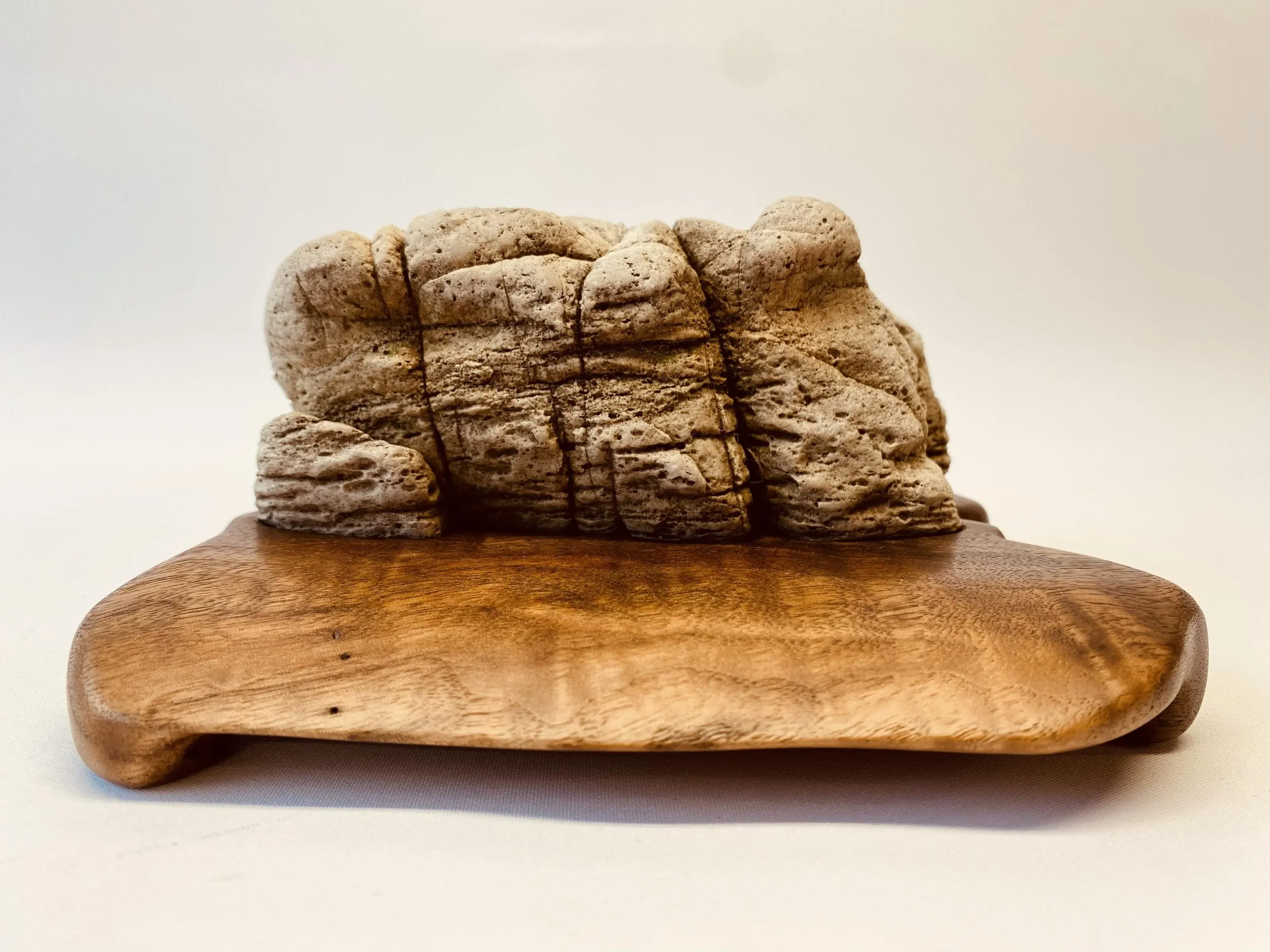 A suiseki stone on a daiza