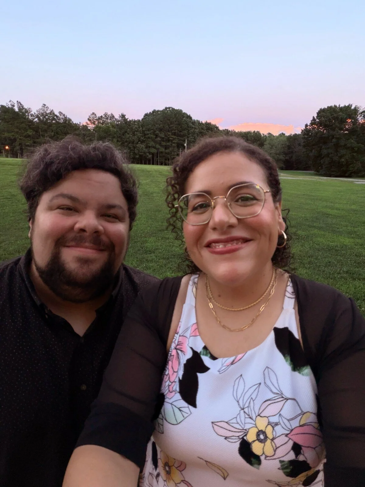 Garrett and his wife Villy smiling together outdoors