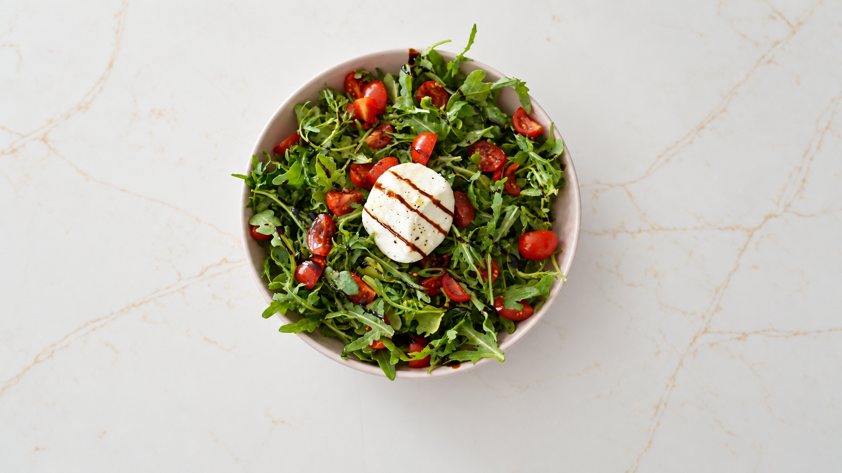 Burrata Salad with cherry tomatoes, arugula, and balsamic glaze