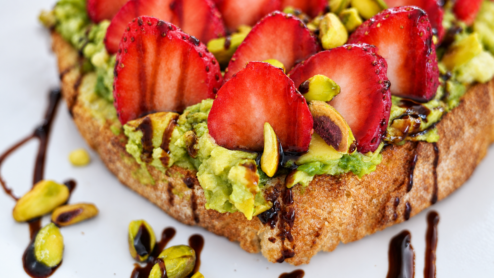 Strawberry Nuts Avocado Toast with fresh strawberries and crunchy nuts