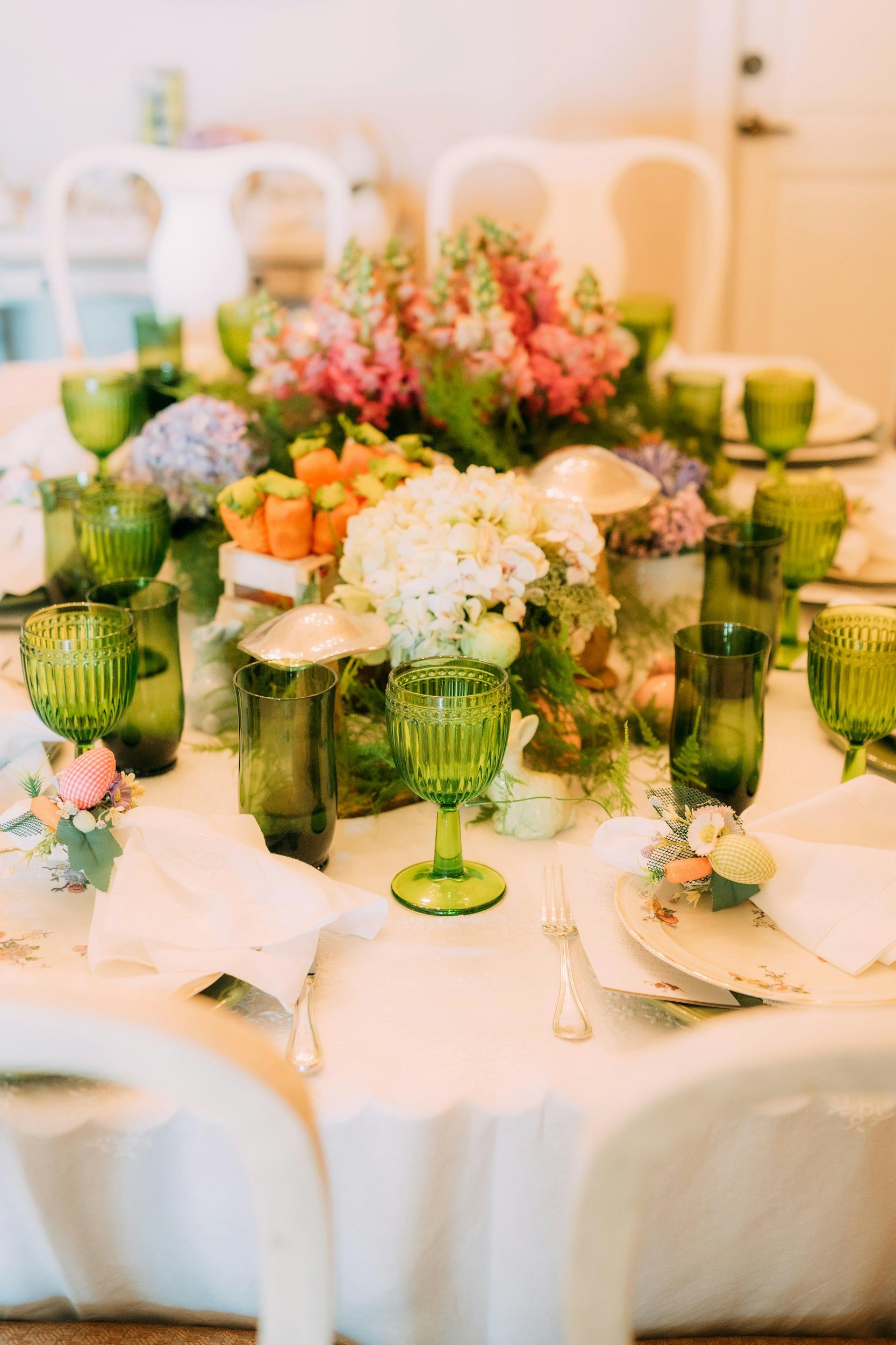 Colorful vintage glasses layered across a character-filled table.