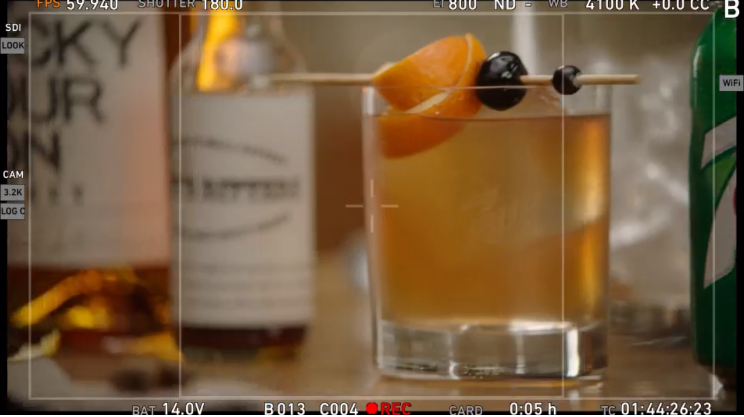 Behind-the-scenes monitor view from a 7Up production, featuring detailed tabletop and food styling for handcrafted cocktail setups.