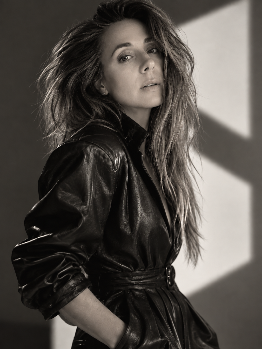 Black-and-white portrait of Brooke McDaniel wearing a BRÜK leather onesie from her emerging fashion project.