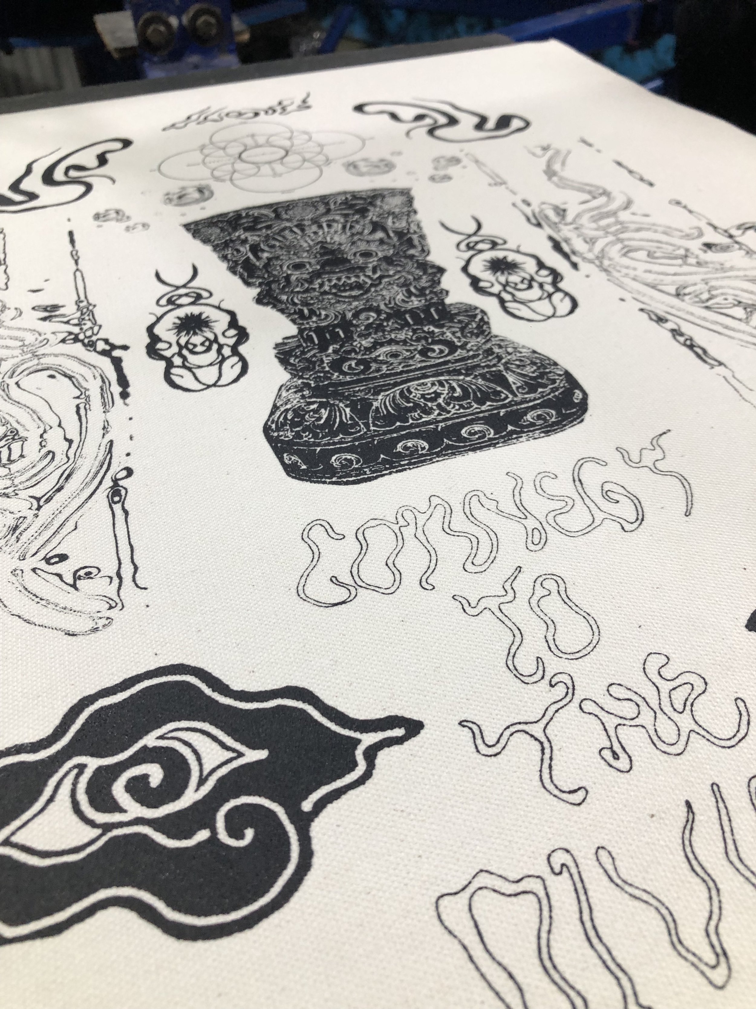 Black and white drawing on paper showing a detailed Barong statue, floral motifs, abstract patterns, and stylized text.